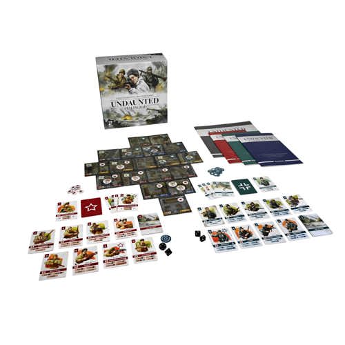 The Undaunted: Stalingrad game box stood behind a fully set-up game of board tiles, two player areas each with an array of cards, dice and tokens, the rulebook, two faction scenario books, and mapbook