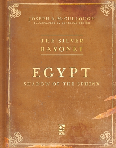 The cover of The Silver Bayonet: Egypt: Shadow of the Sphinx, stylised as a weathered old book with sandy tones and scarred by claw marks