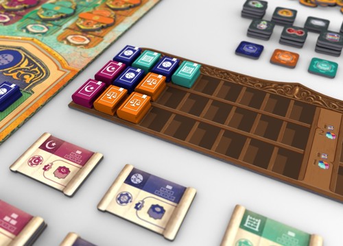 An image of the game's library scoring board, divided into three shelves on each of which are placed wooden book tokens in different colours and with different symbols printed on them