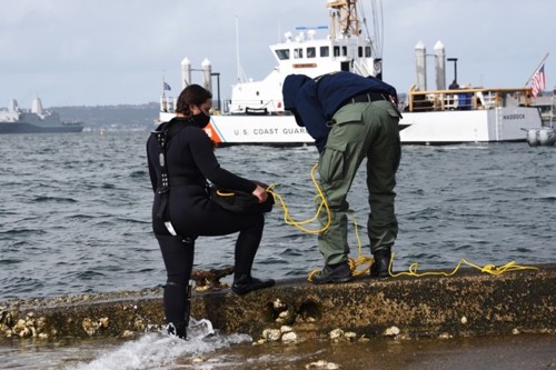 The two female divers of the US Coast Guard, Monique Gillbreath and Kirsten Allen, prepare for a diving task