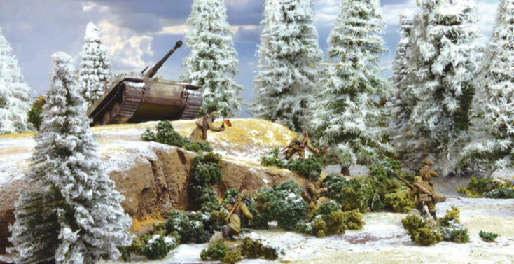 Fully painted miniature figures and terrain for wargaming: Soviet soldiers attacking an advancing tank in a snowy forest