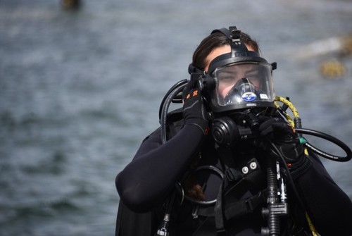 Monique Gillbreath prepares to enter the water for a diving task