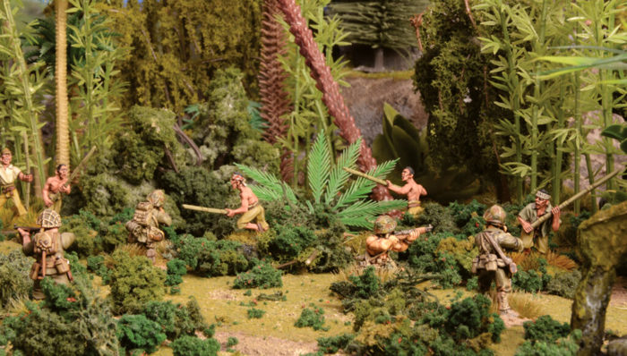 A photo of fully painted miniatures and terrain for the WW2 wargame Bolt Action: Japanese and US troops fighting in the jungle