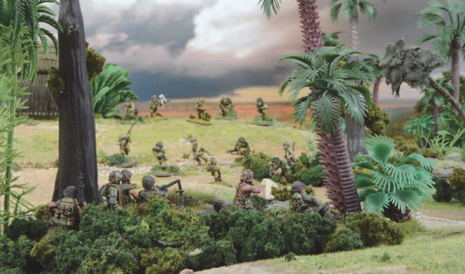 A photo of fully painted miniature figures and terrain depicting a unit of WW2 soldiers advancing while a machine gun team takes aim from cover in some bushes