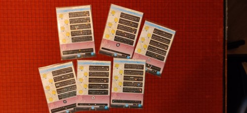 A photo of prototype cards for Imperium: Horizons' trade module