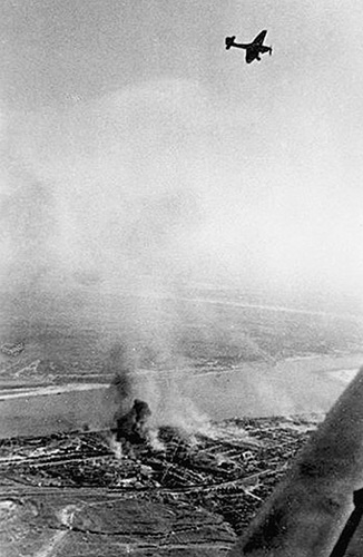 A Ju 87 Stuka banks over Stalingrad towards the west and away from the Volga River